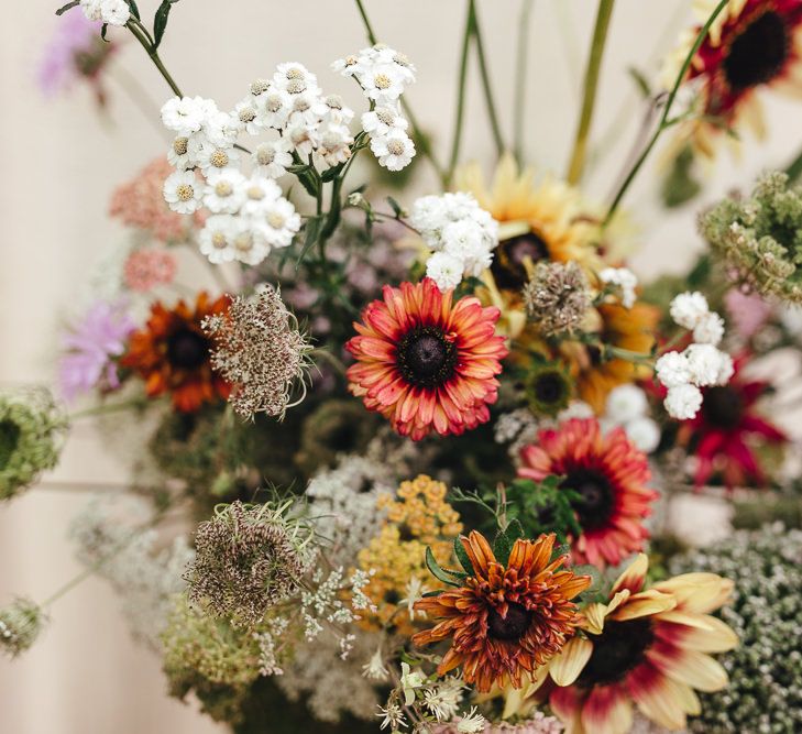 Bright and bold blooms for bouquet at boho wedding