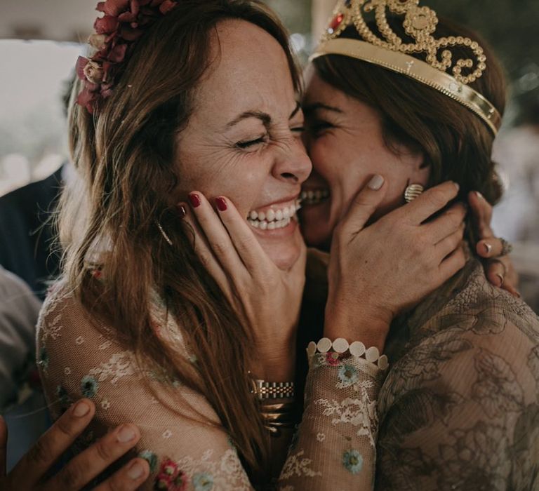 Flower crowns and plastic crowns at relaxed wedding reception