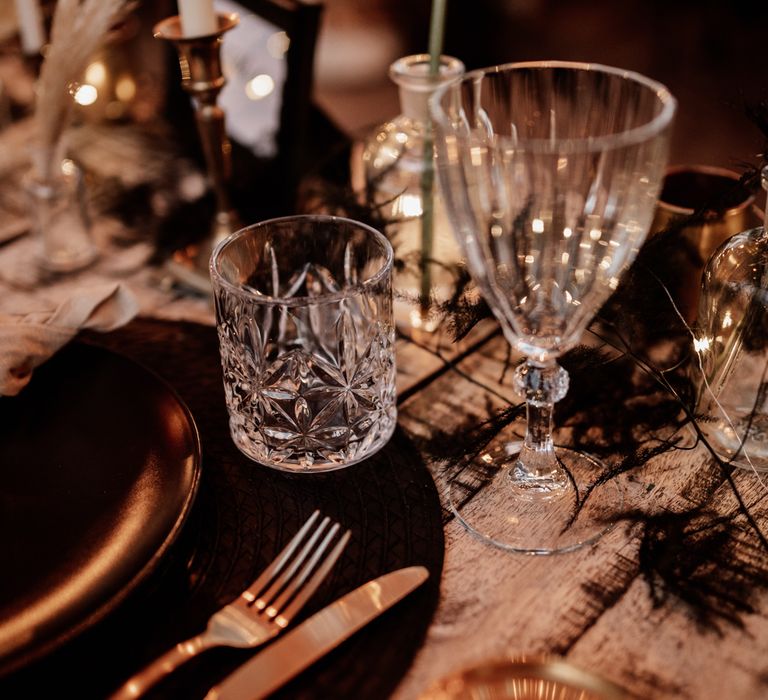 Crystal tumbler on black & white table decor