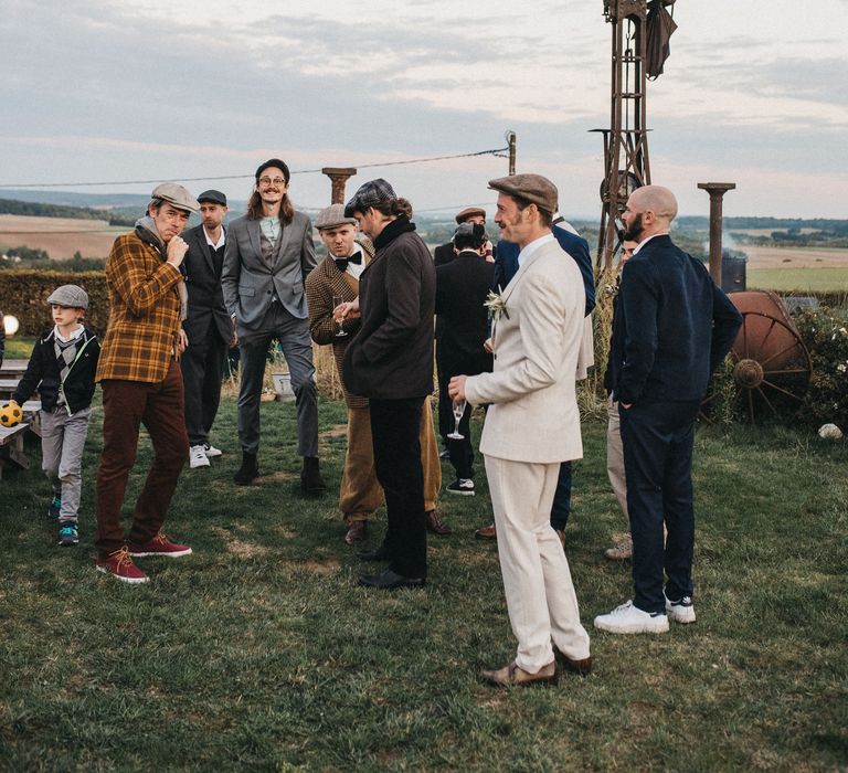 Groom and groomsmen in Peaky Blinders wedding suits 