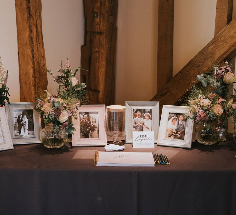 Table featuring a time capsule of relatives wedding photos