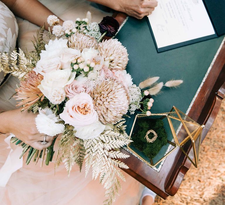 Guests sign the wedding guestbook