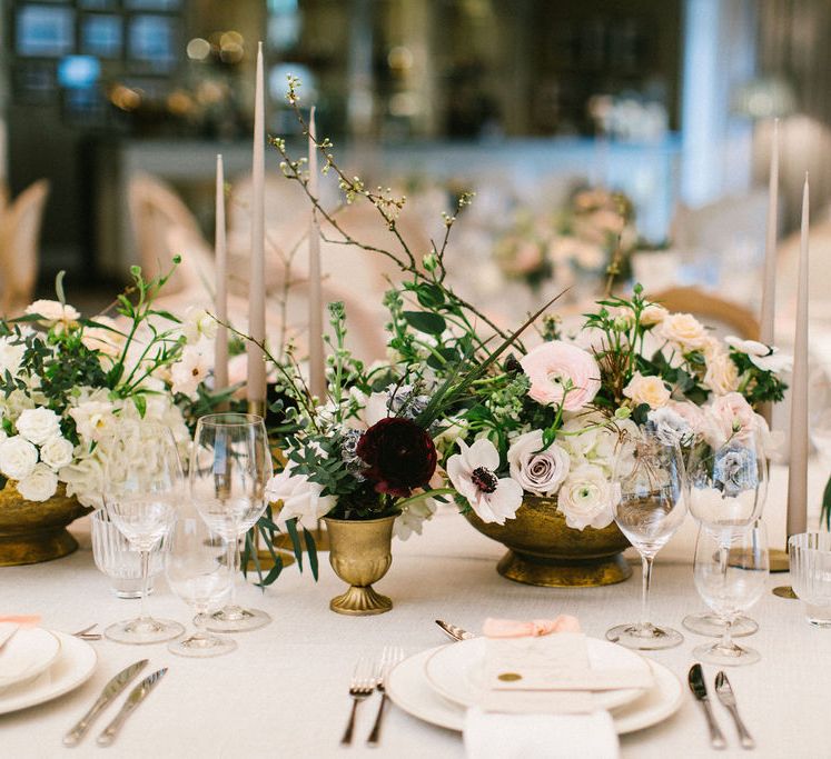 Pink and white floral centrepiece decor with roses, anemones and ranunculus 