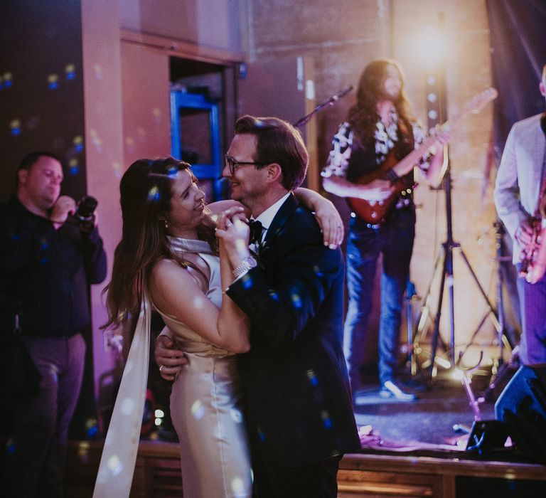 Bride & groom dance with one another on the day of their wedding during wedding reception