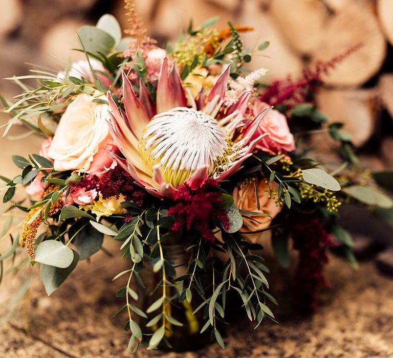 pink protea wedding bouquet 