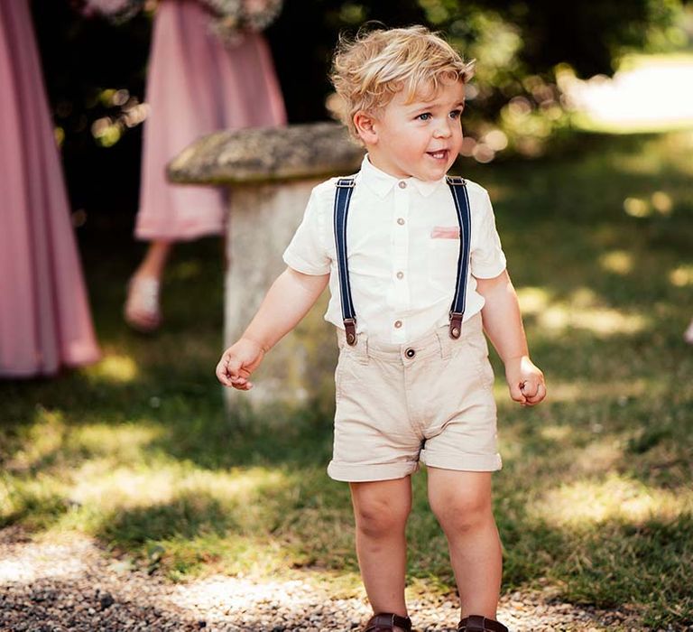 Cute wedding guest in chino shorts and braces