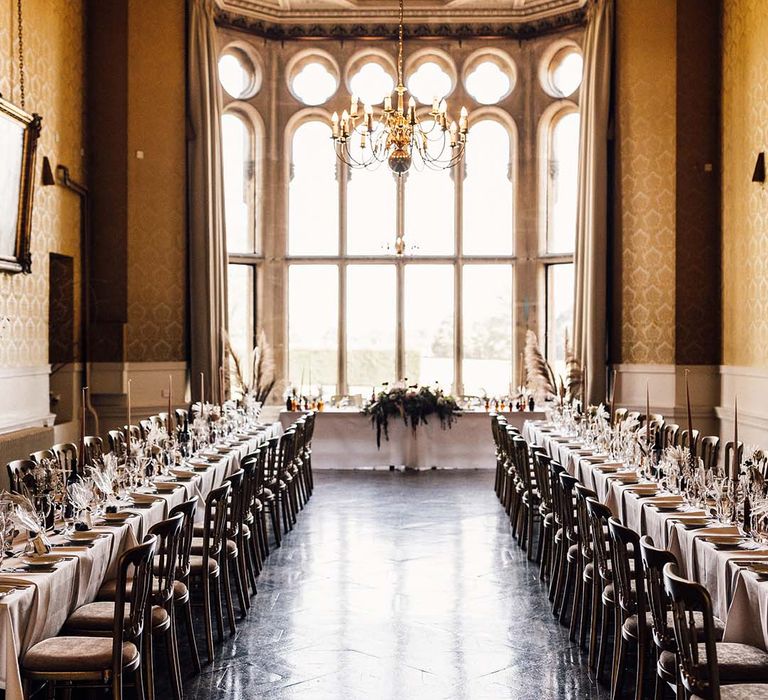 Wedding reception complete with two tables and impressive windows