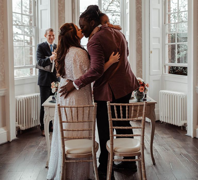 Bride & groom kiss on their wedding day