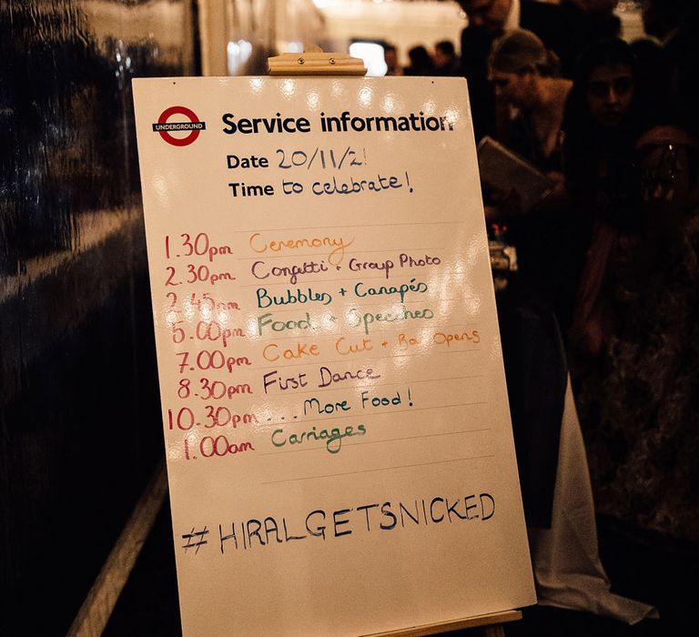 London underground themed wedding table plan on wooden easel