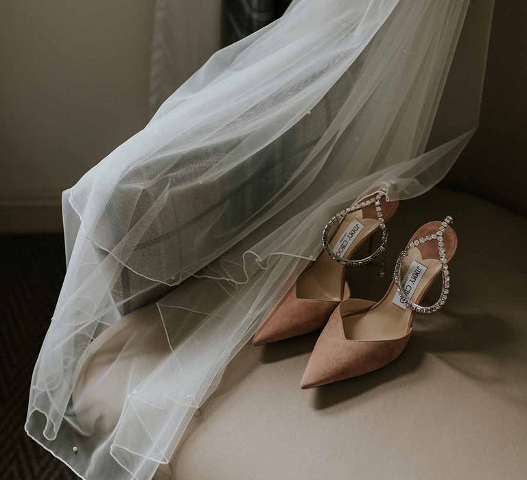 White long veil and nude Jimmy Choos with bejewelled ankle strap 