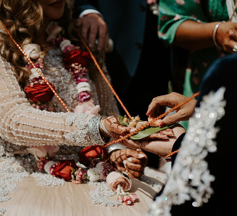 Bride & groom during Hindu wedding ceremony outdoors at the Lillibrooke Manor And Barns