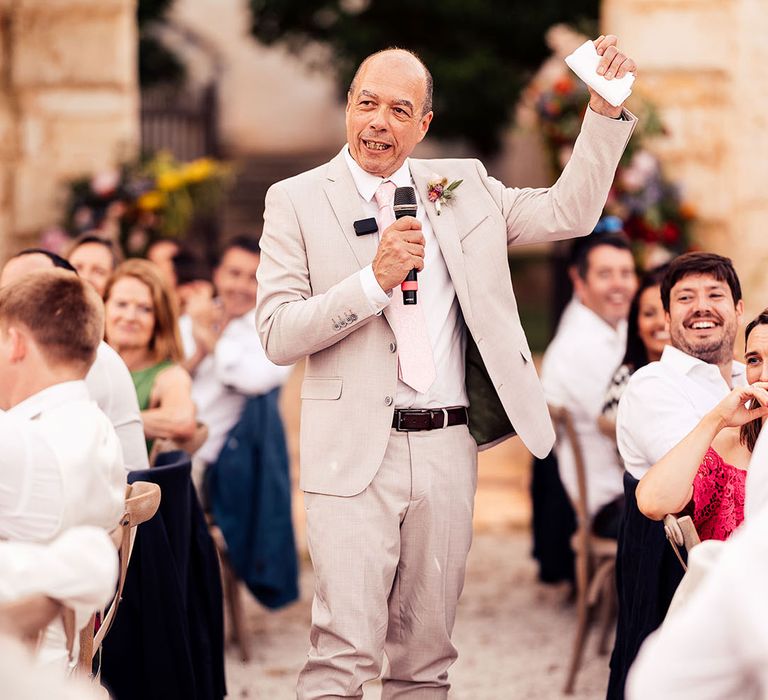 Wedding guest stands and delivers a wedding speech