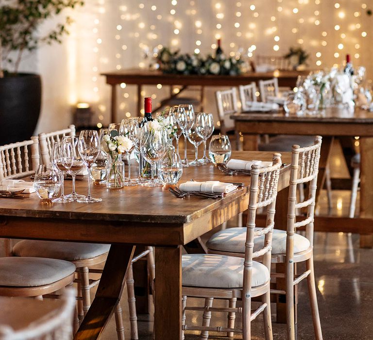 Rustic wooden table at Trinity Buoy Wharf complete with fairy light canopy and sweetheart table 