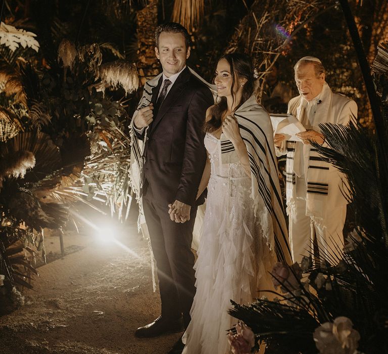 Bride & groom during traditional Jewish wedding ceremony 