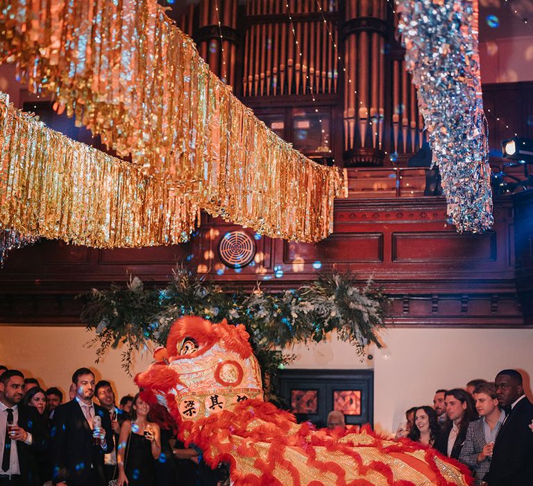 Silver and gold wedding streamers and traditional Chinese Lion Dance wedding entertainment