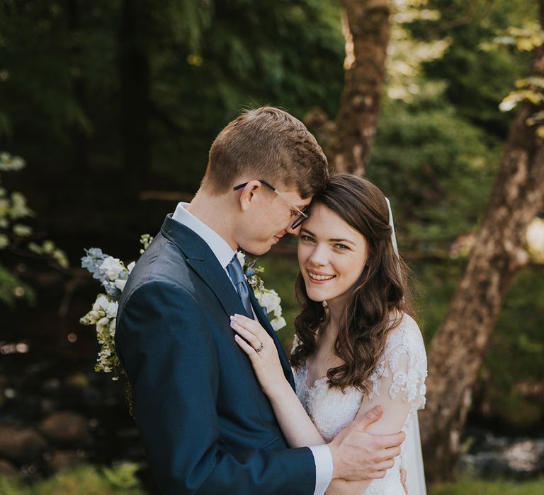 The bride and groom share an intimate embrace on their wedding day 