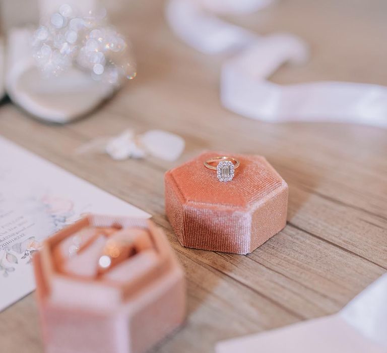 Bride's diamond engagement ring in pink velvet ring box 