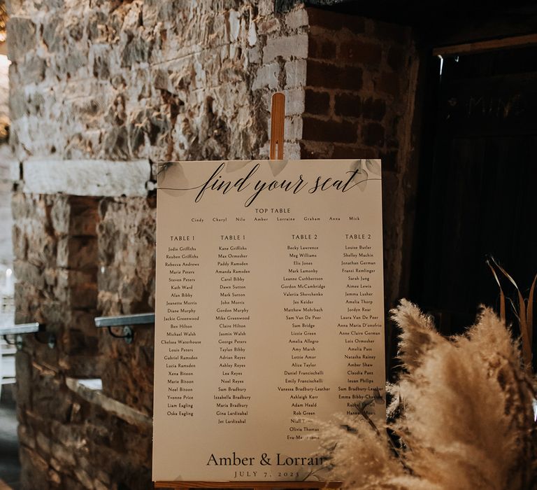 Wedding seating chart signage for rustic barn wedding at Lyde Court 