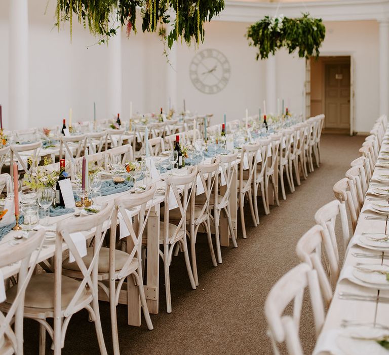 Pennsylvania Castle Estate wedding venue with long banquet tables and dusty blue decorations 