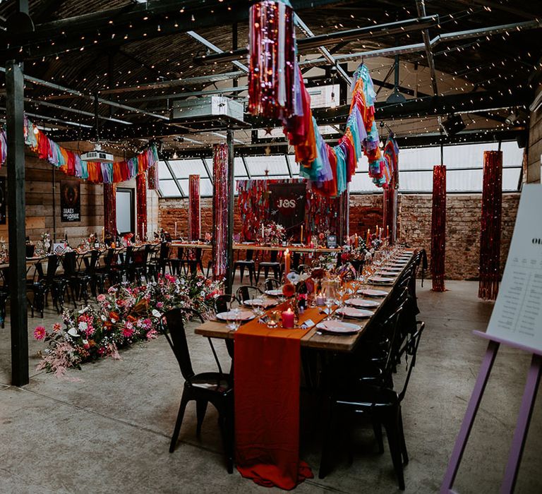 The Shack Revolution in the West Midlands decorated with rainbow streamers and retro decorations for 80s theme wedding 