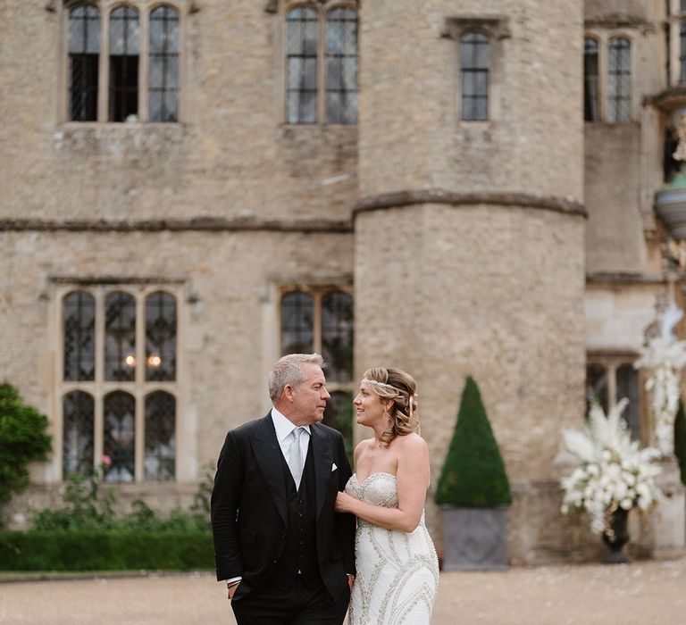 Bride in beaded Badgley Mischka wedding dress with groom at mansion wedding in Suffolk