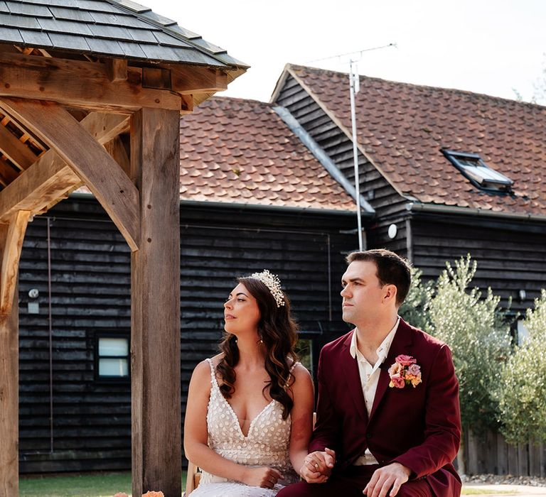 The bride and groom sit for their wedding ceremony at The Canary Shed 