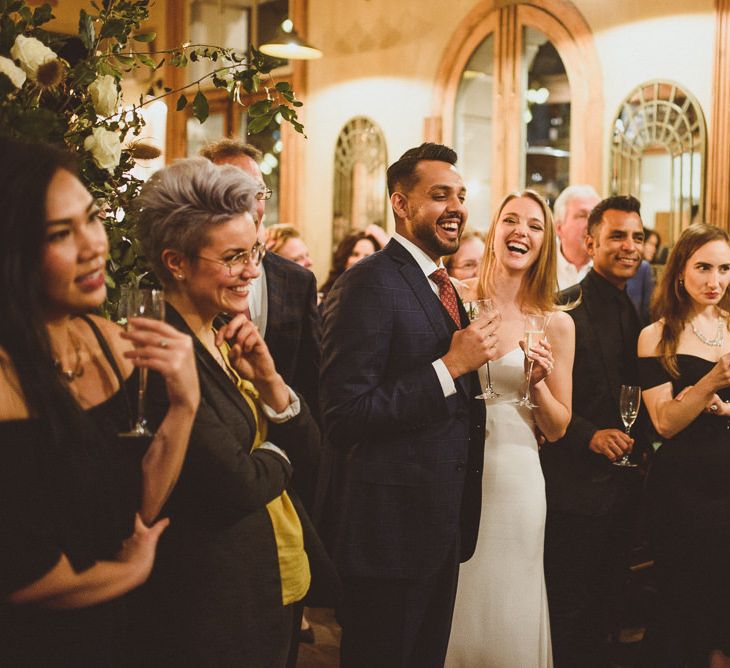 Bride and groom speeches at Chelsea wedding with Champagne 