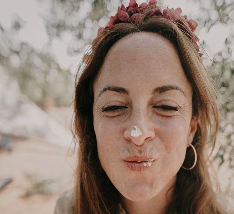 Bride gets cake on her nose at buffet wedding