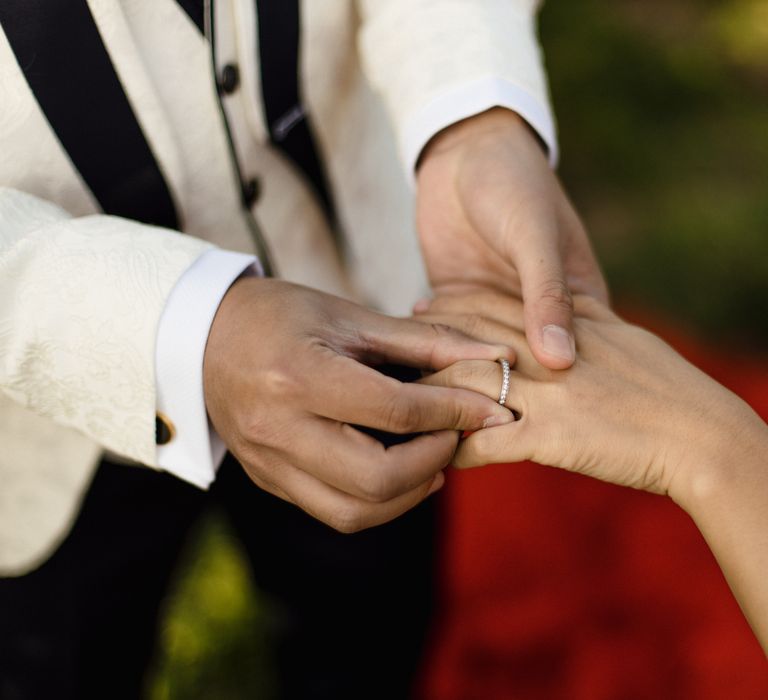 Exchanging rings at Eastbrook Estate wedding ceremony