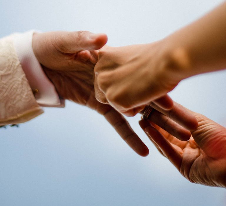 Exchanging wedding rings at an outdoor ceremony in East Sussex