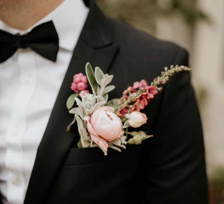 Pink and green grooms buttonhole 