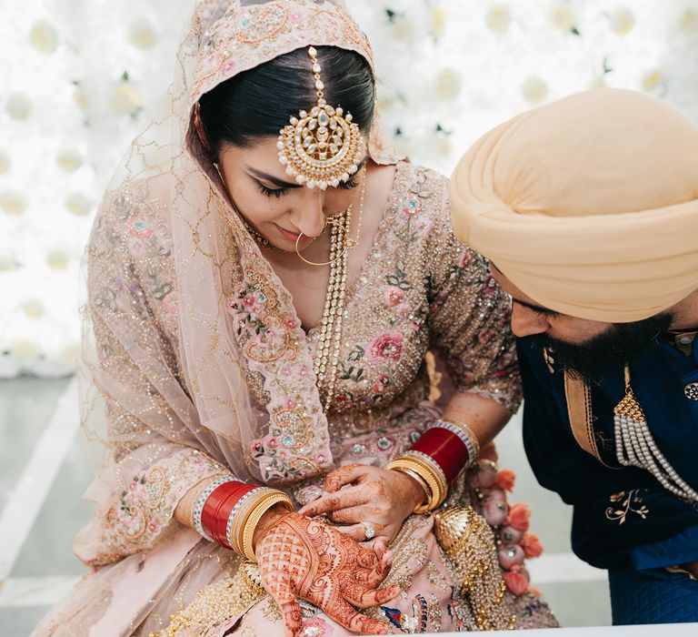 Bride wears embroidered and embellished Lehengha 