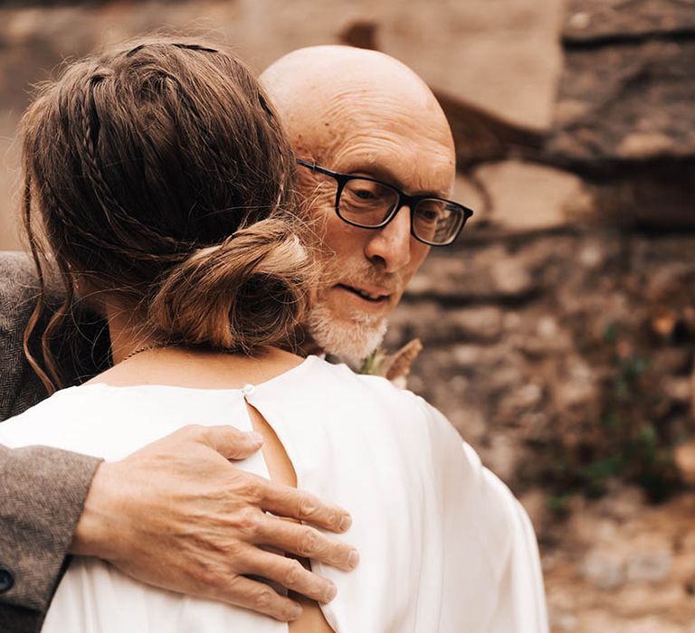 Bride hugs her father on her wedding day