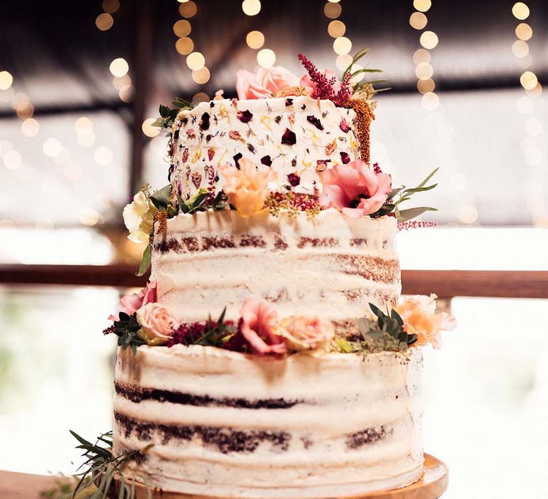 3-tier naked wedding cake complete with dried flowers and rustic vibe