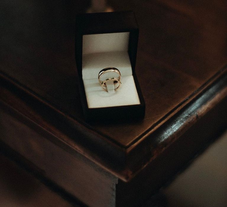 Gold wedding bands in velvet box