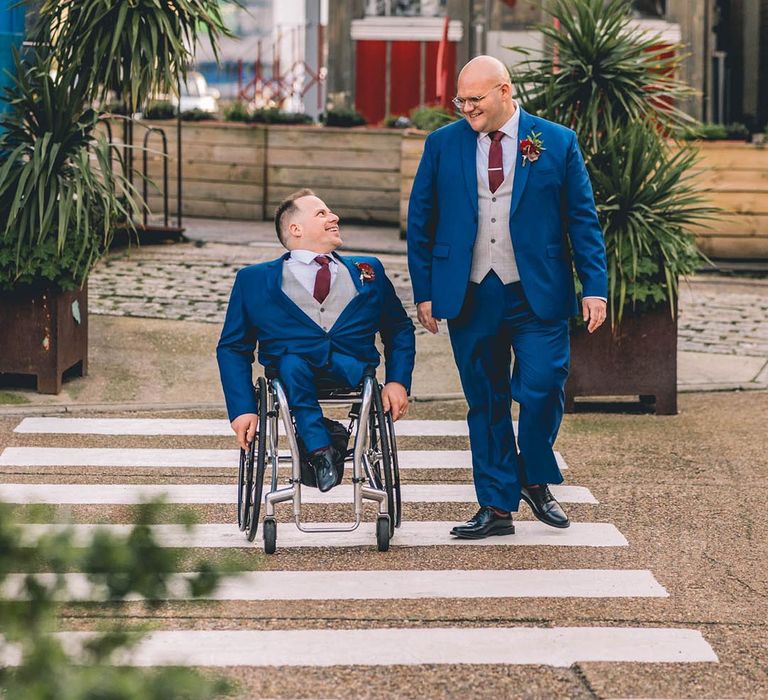 Grooms in blue wedding suits at accessible wedding venue in London