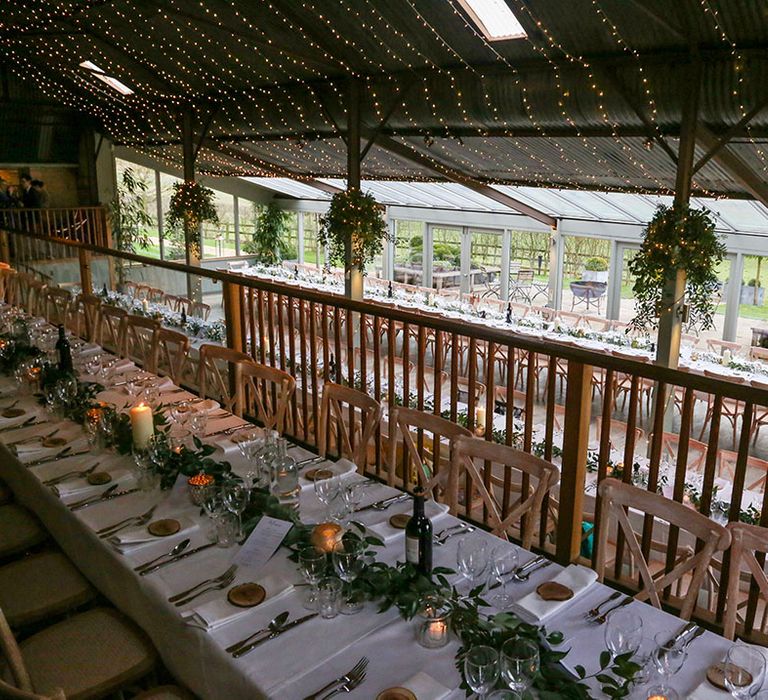 Rustic wedding reception complete with table on balcony 