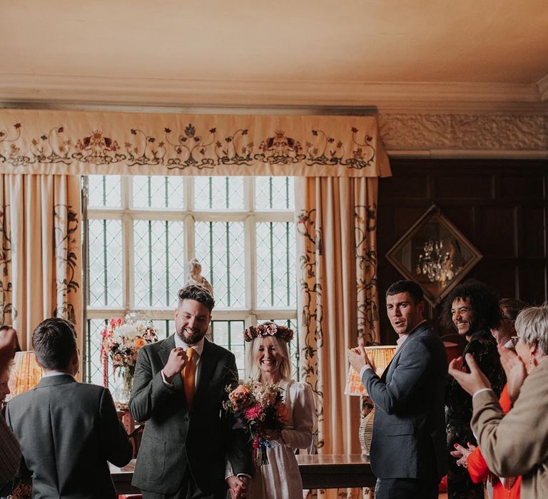 Bride and groom celebrate after getting married at civil ceremony