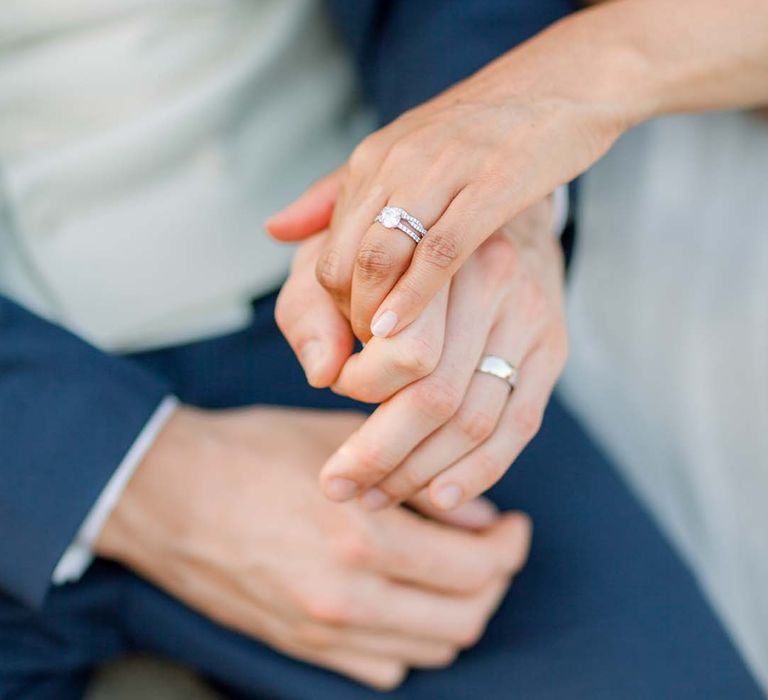 Bride & groom hold hands on their wedding day