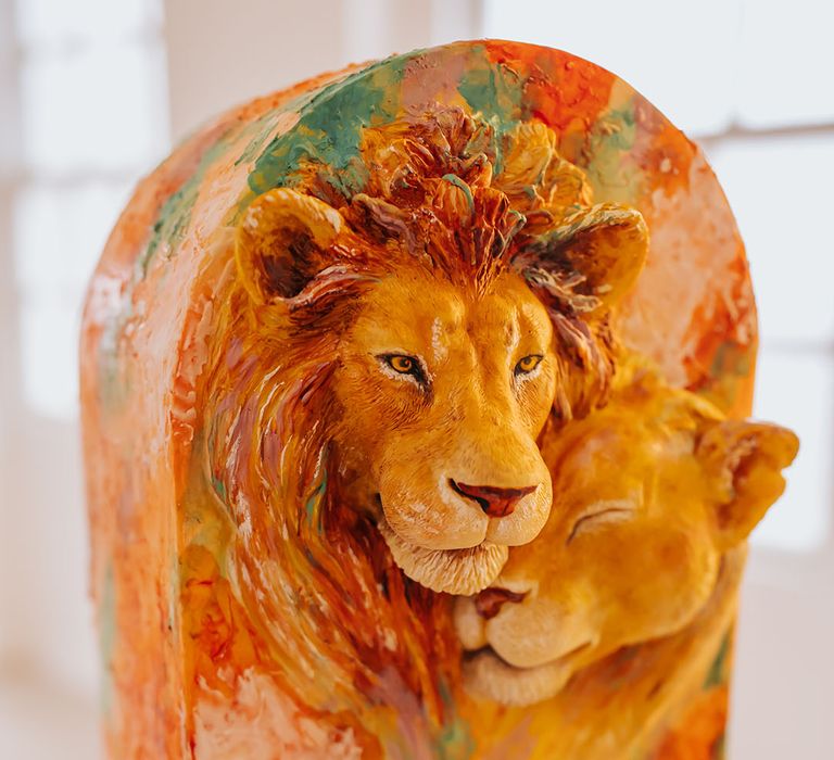 Golden wedding cake with Lion King design 