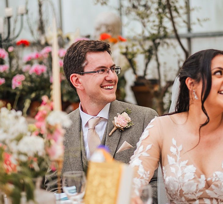 Bride & groom during greenhouse reception at the West Green House 