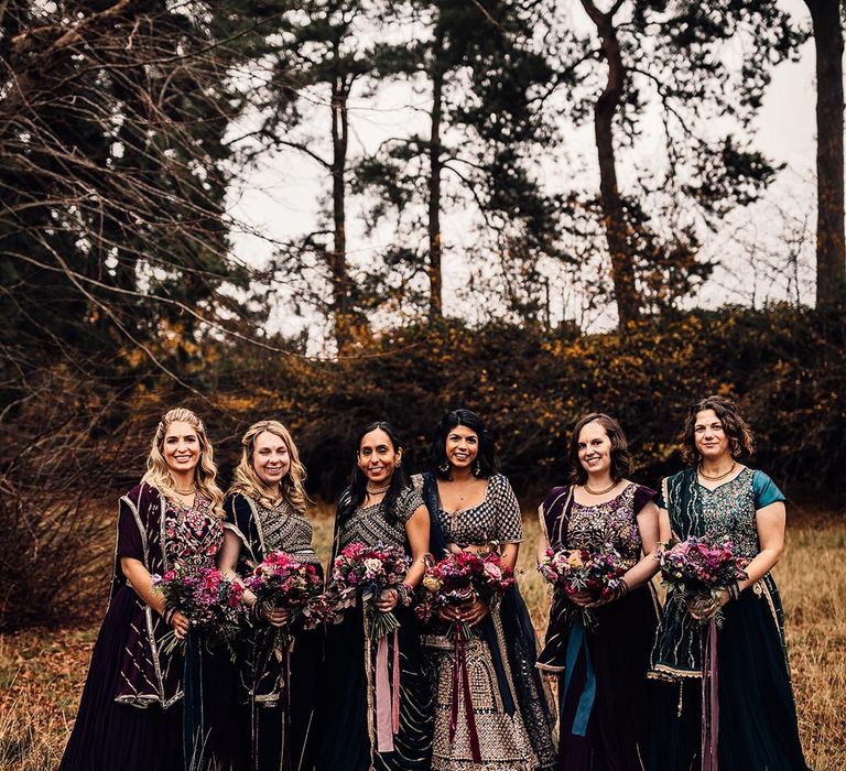 Bridesmaids in traditional Indian wedding attire with embellished details 