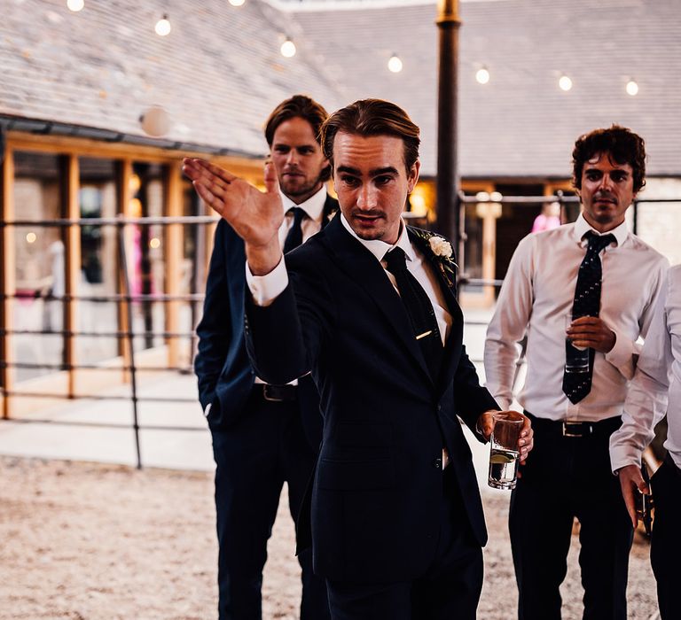 The groom gets involved in a game of Prosecco pong 