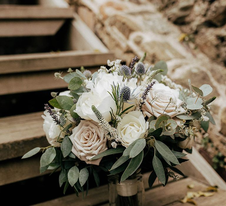 Pale pink and white roses complete with green foliage bridal bouquet 