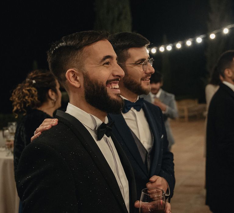 Grooms smiling during outdoor wedding speeches at Hotel Cortijo Bravo, Vélez-Málaga, Málaga