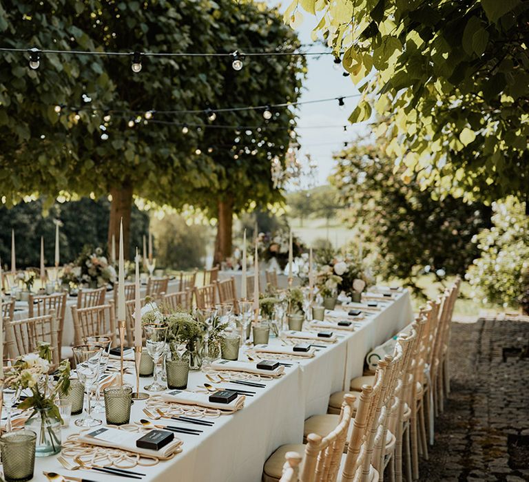 Outdoor summer wedding tablescape with white and green wedding table decorations 