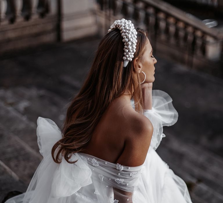 Daniel Chu wedding dress with tulle bow with butterflies and pearls 