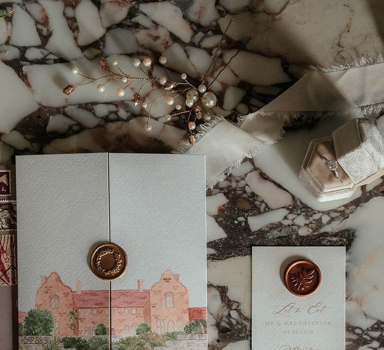 Custom watercolour wedding stationery with gold wax seal 