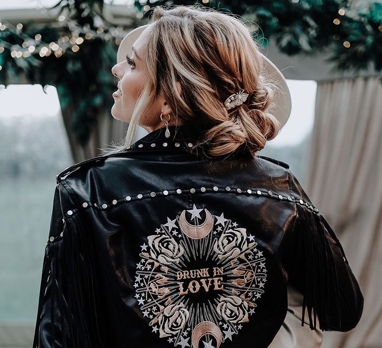 Bride in black leather jacket with personalised detail on the back 