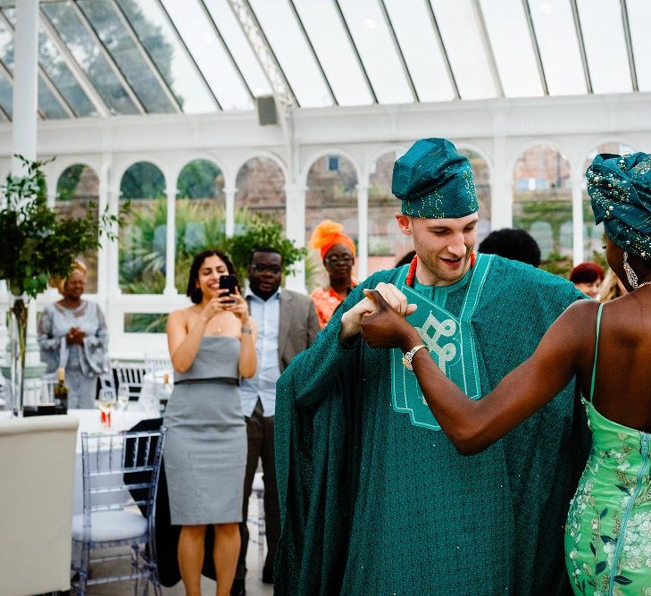 Bride and groom first dance in Nigerian outfits 